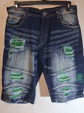 Men's Arketype denim distressed rips with green patchwork underneath. Size 36.